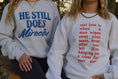 Load image into Gallery viewer, He Still Does Miracles Sweatshirt

